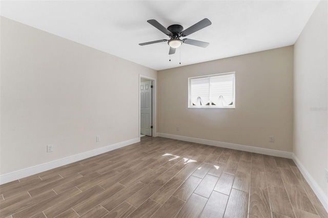 spare room featuring ceiling fan and light hardwood / wood-style flooring