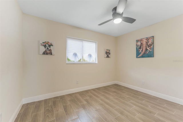 spare room featuring ceiling fan and light hardwood / wood-style floors