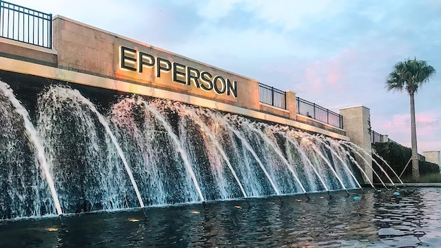 outdoor building at dusk featuring a water view