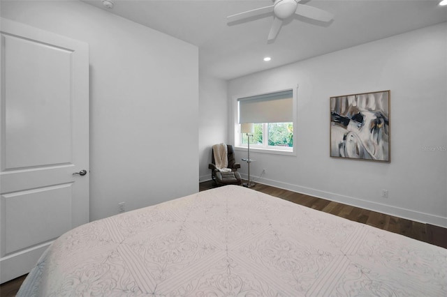 bedroom with ceiling fan and dark hardwood / wood-style flooring