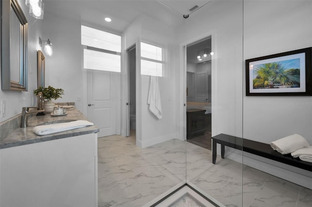 bathroom with toilet and vanity