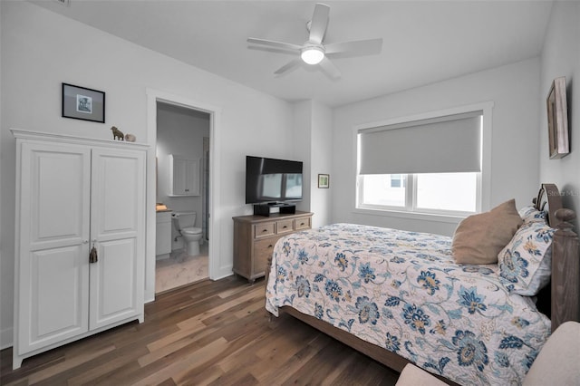 bedroom featuring ceiling fan, connected bathroom, and dark hardwood / wood-style floors