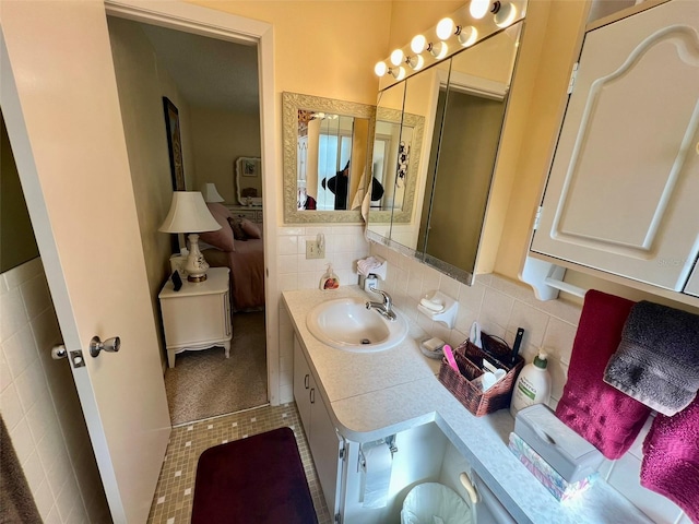 bathroom featuring tile patterned flooring and vanity