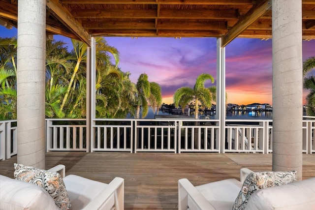 wooden terrace with a water view