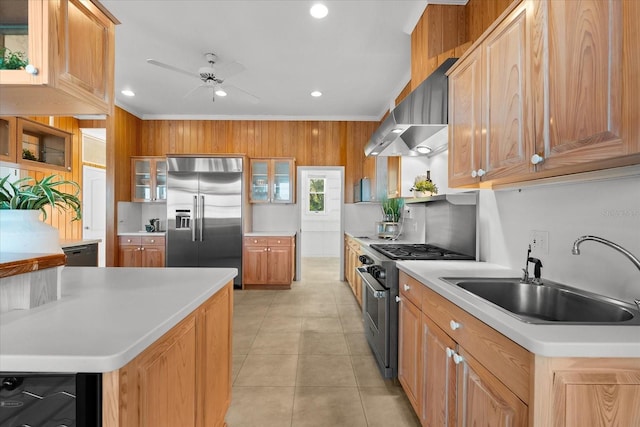 kitchen featuring ventilation hood, glass insert cabinets, light countertops, high end appliances, and a sink