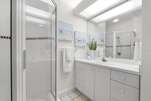 bathroom with vanity, an enclosed shower, tile patterned flooring, and ornamental molding