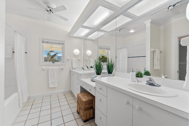 bathroom with tile patterned flooring, vanity, a wealth of natural light, and ceiling fan