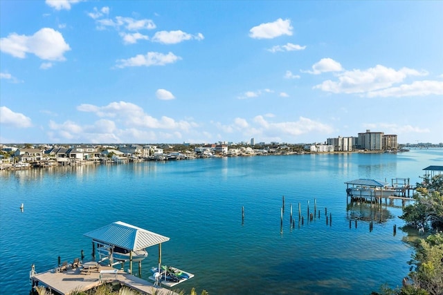 view of dock with boat lift and a water view