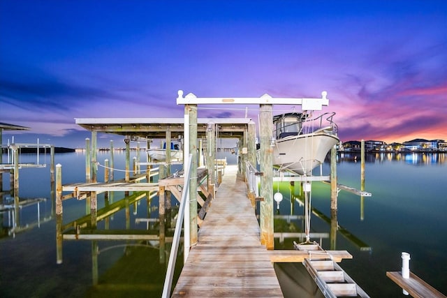 view of dock featuring a water view and boat lift