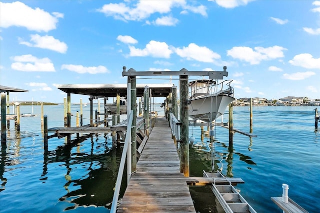 dock area featuring a water view and boat lift