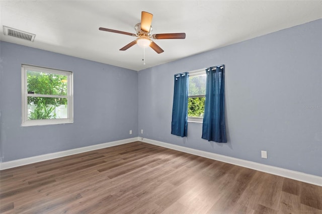 empty room featuring ceiling fan and wood-type flooring