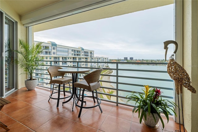 balcony featuring a water view