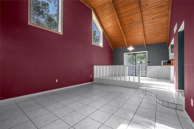 empty room featuring light tile patterned flooring, high vaulted ceiling, a chandelier, wood ceiling, and beam ceiling