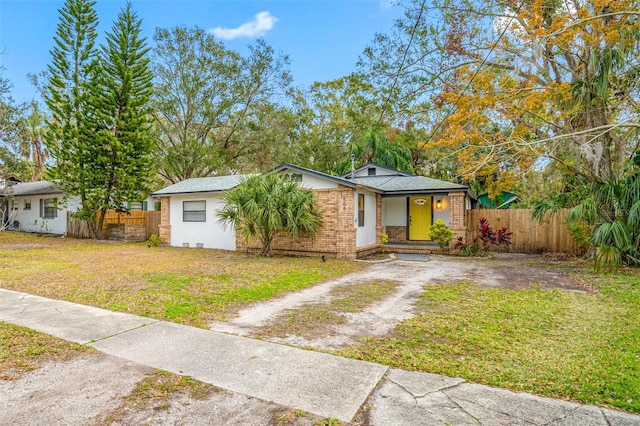 view of front of home featuring covered porch and a front yard