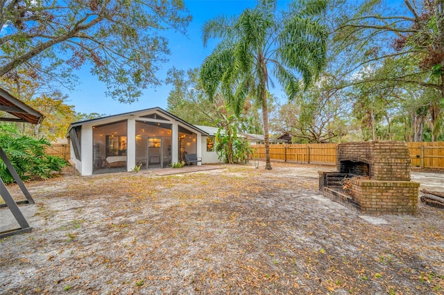 view of yard with a sunroom