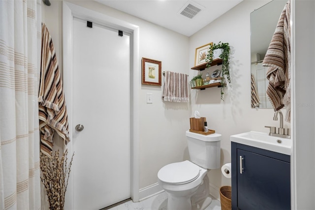 bathroom featuring vanity and toilet