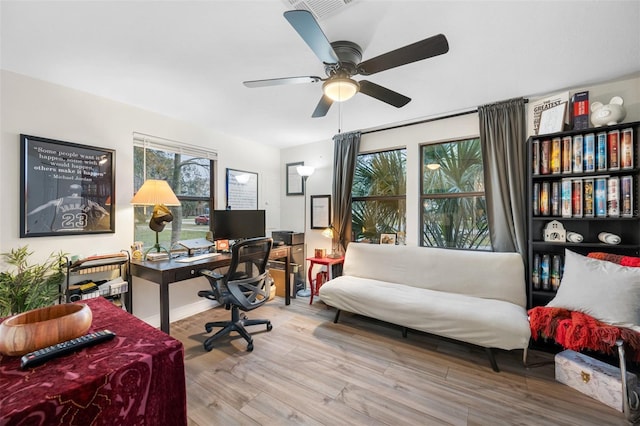 office space featuring ceiling fan and light wood-type flooring