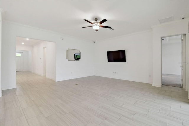 spare room featuring crown molding and ceiling fan