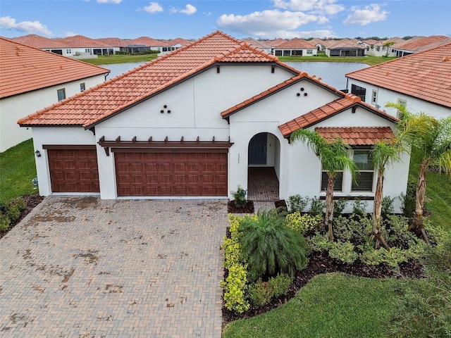 mediterranean / spanish-style home featuring a garage