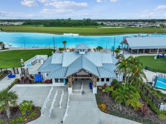 birds eye view of property with a water view