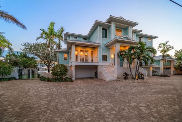 view of front of house with a garage and a balcony