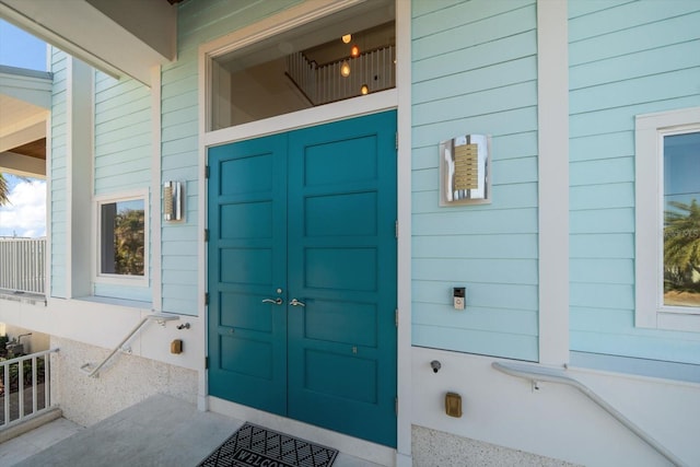 view of exterior entry with covered porch