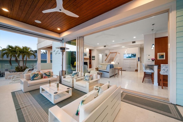 interior space featuring ceiling fan and an outdoor hangout area