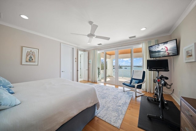 bedroom with access to exterior, ceiling fan, french doors, hardwood / wood-style floors, and ornamental molding