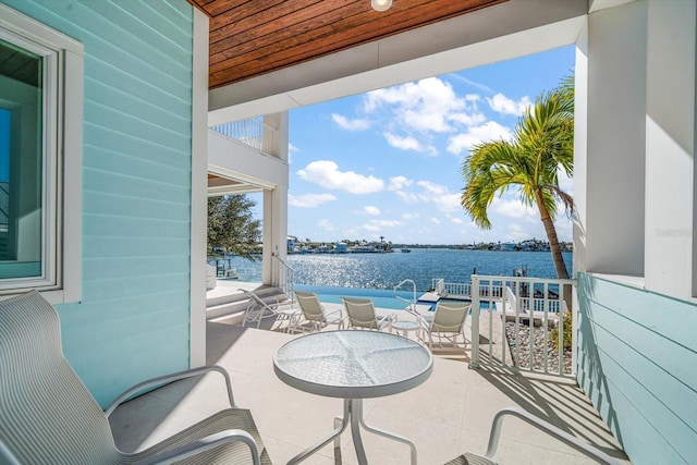 view of patio featuring a water view