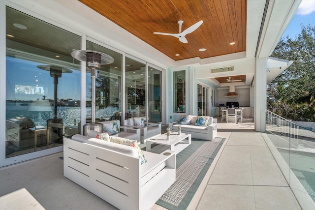 view of patio featuring outdoor lounge area and ceiling fan