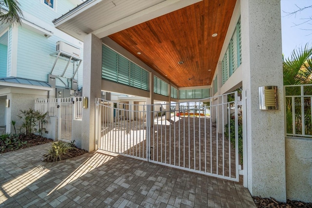 exterior space featuring an AC wall unit