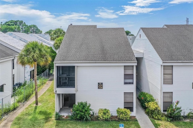 back of house with a yard