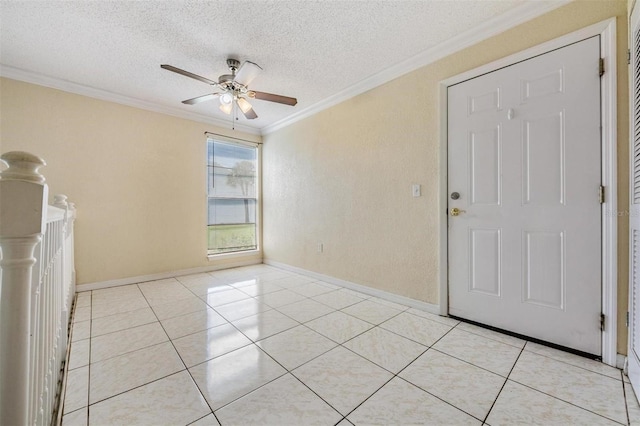 interior space with a textured ceiling, ceiling fan, light tile patterned flooring, and crown molding