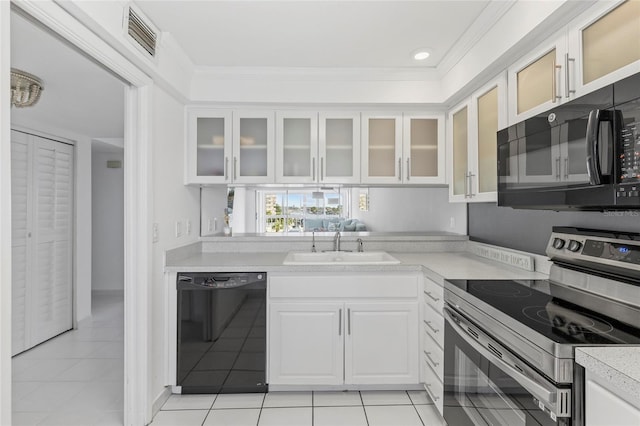 kitchen featuring black appliances, crown molding, sink, white cabinetry, and light tile patterned flooring