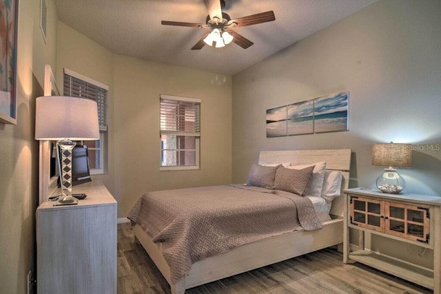 bedroom featuring ceiling fan and wood-type flooring