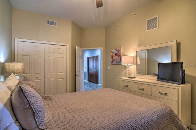 bedroom featuring ceiling fan and a closet