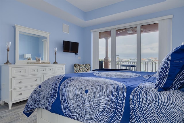 530 S Gulfview Blvd Unit 205, Clearwater, FL 33767 - bedroom featuring access to outside and light wood-type flooring
