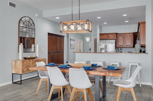 530 S Gulfview Blvd Unit 205, Clearwater, FL 33767 - dining area with light wood finished floors and recessed lighting