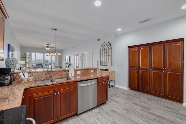 530 S Gulfview Blvd Unit 205, Clearwater, FL 33767 - kitchen with stainless steel dishwasher, light stone counters, a peninsula, ceiling fan, and recessed lighting