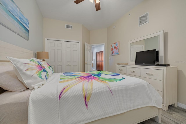 530 S Gulfview Blvd Unit 205, Clearwater, FL 33767 - bedroom featuring light wood-style floors, a closet, and a ceiling fan