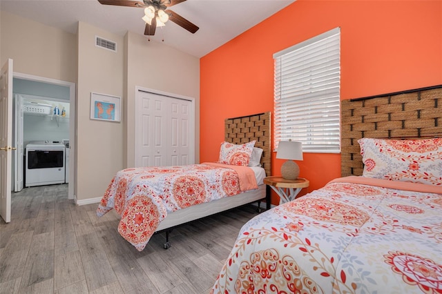 530 S Gulfview Blvd Unit 205, Clearwater, FL 33767 - bedroom with washer / clothes dryer, wood finished floors, a closet, and ceiling fan