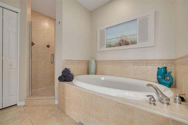 530 S Gulfview Blvd Unit 205, Clearwater, FL 33767 - bathroom featuring a shower stall, a garden tub, and tile patterned flooring