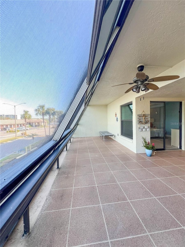 view of patio / terrace featuring a balcony and ceiling fan