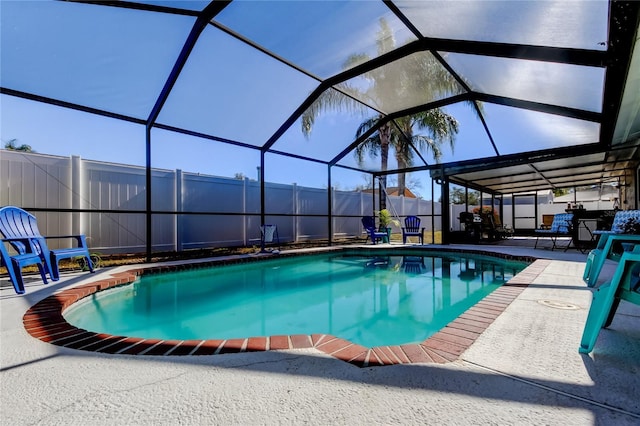 view of pool featuring a lanai and a patio