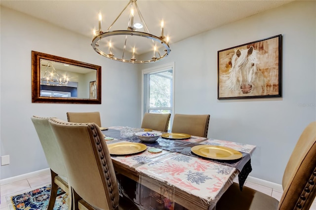 dining room featuring a chandelier and light tile patterned floors