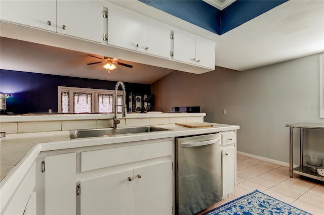 kitchen with dishwasher, light tile patterned floors, white cabinets, ceiling fan, and sink