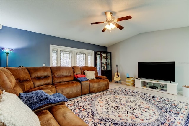 tiled living room with ceiling fan and vaulted ceiling