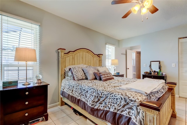 bedroom with ceiling fan and light tile patterned floors