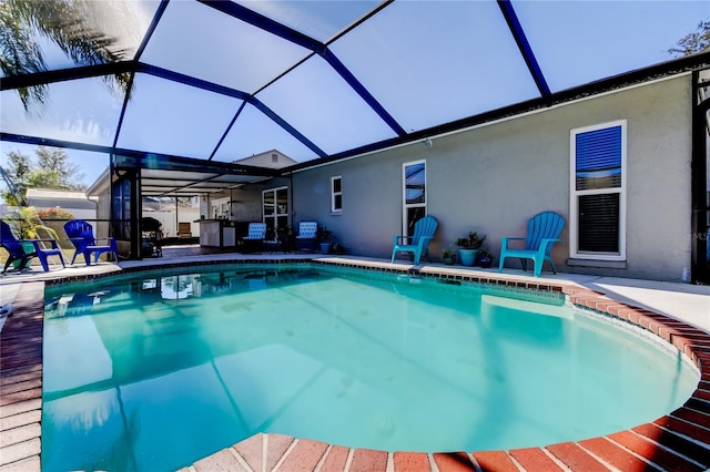 view of pool featuring a lanai and a patio area