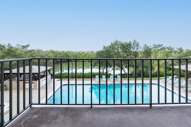 balcony featuring a water view